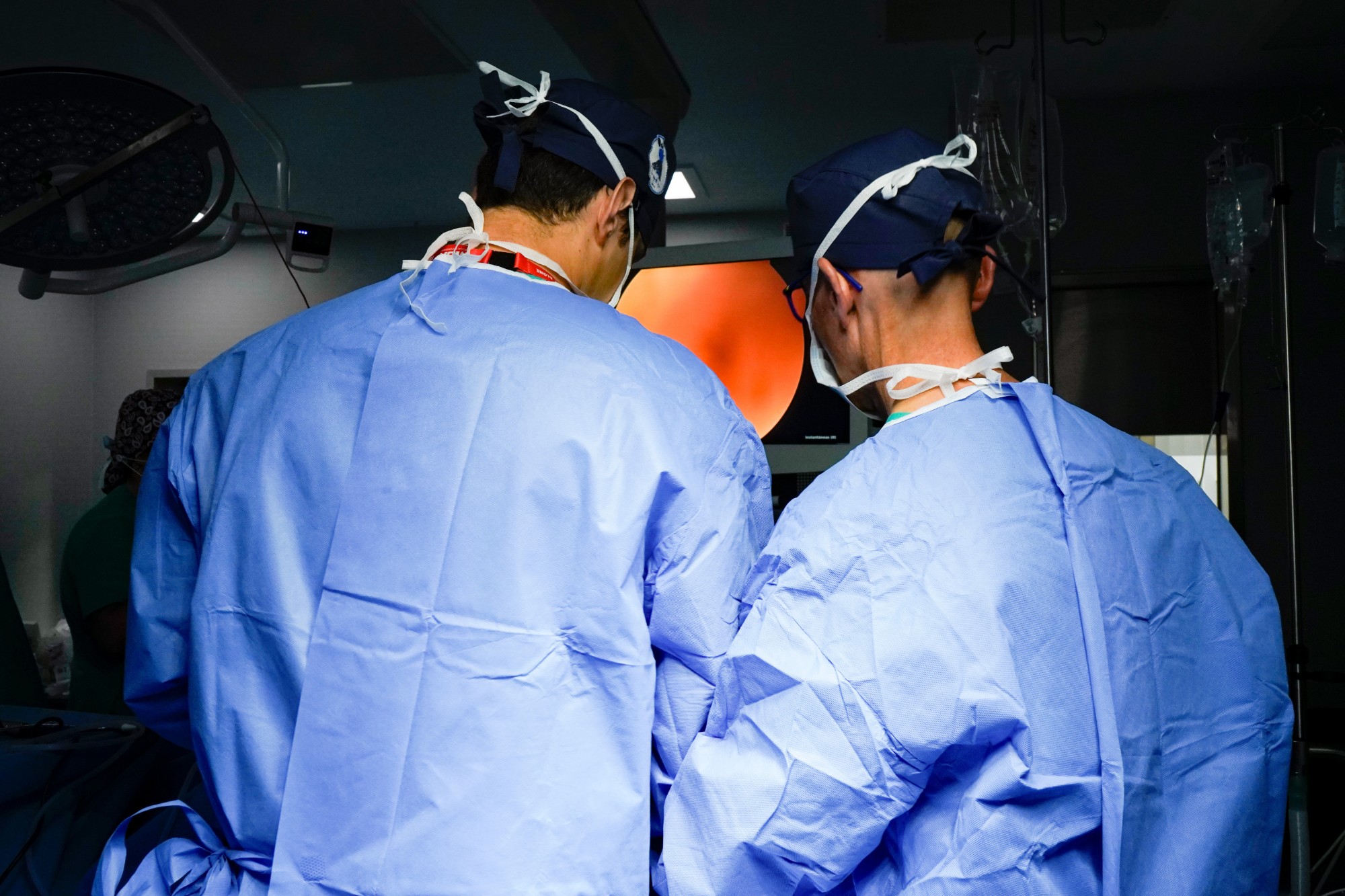 Surgeons reviewing the arthroscopy monitor
